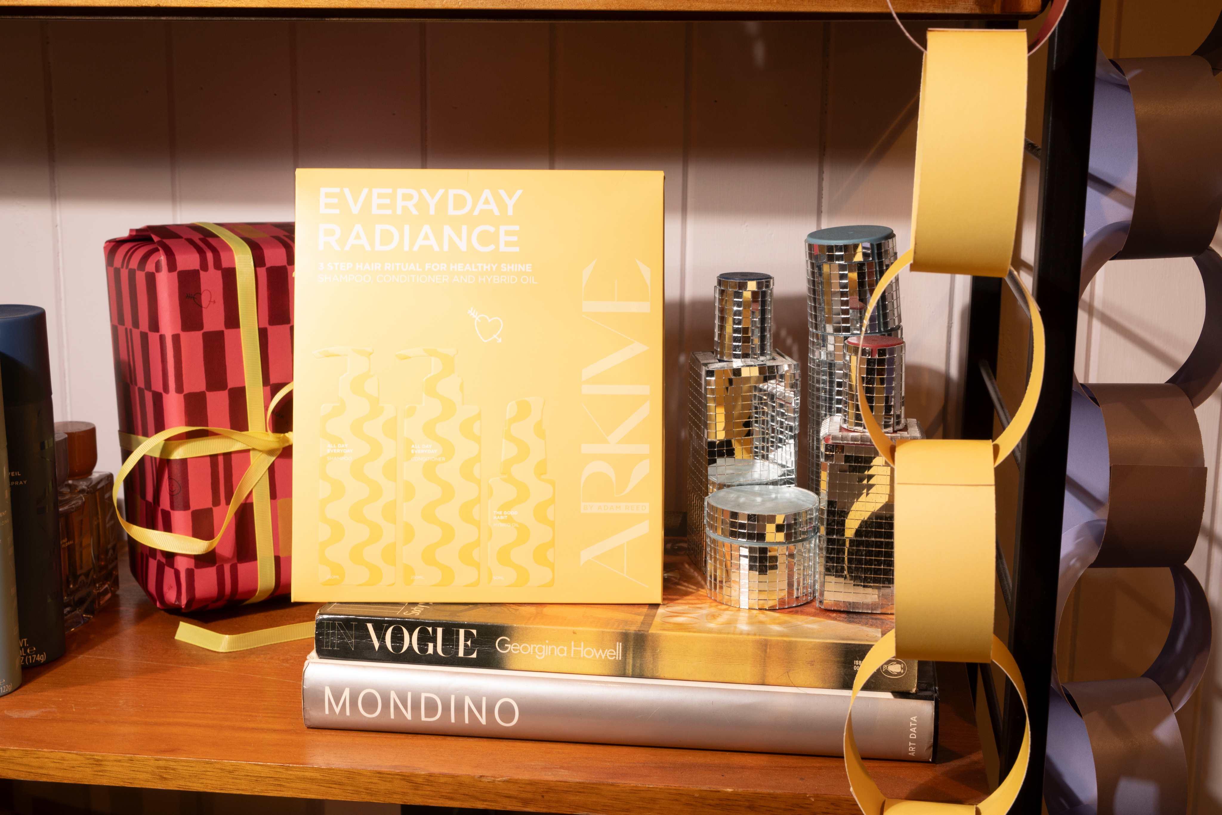 Graphic depicting a hexagonal cropped photo of an interior room design with grid lines along its borders.